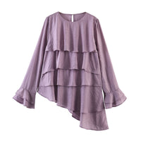 Asymmetric stacked decorative tops on the street